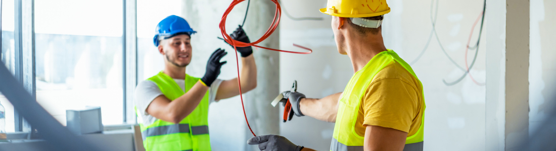 Two contractors working on a job site